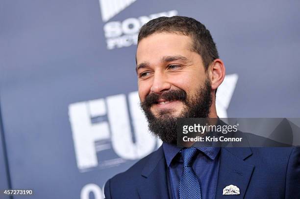 Shia LaBeouf poses for photographers on the red carpet during the "The Fury" Washington D.C. Premiere at The Newseum on October 15, 2014 in...