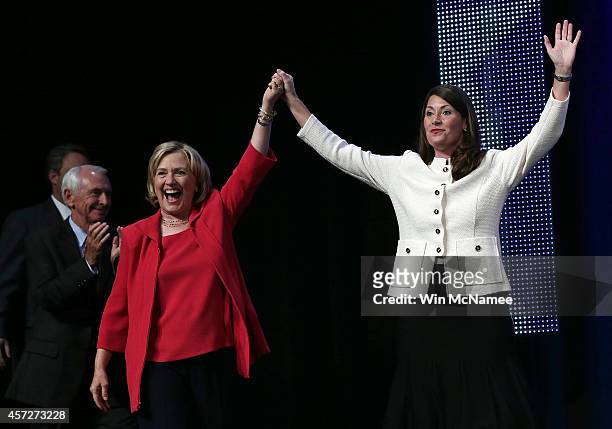 Former U.S. Secretary of State Hillary Clinton campaigns with U.S. Senate Democratic candidate and Kentucky Secretary of State Alison Lundergan...