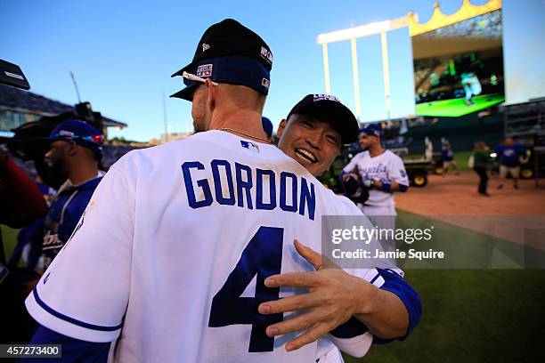 Alex Gordon of the Kansas City Royals celebrates with Norichika Aoki after their 2 to 1 win over the Baltimore Orioles to sweep the series in Game...