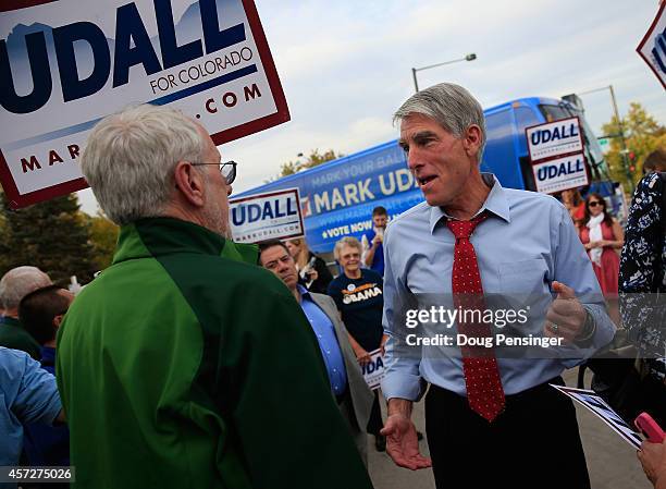 Sen. Mark Udall greets supporters as he kicks off his 'Mark Your Ballot' bus tour on October 15, 2014 in Denver, Colorado. Udall is running for...