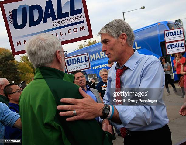 Sen. Mark Udall greets supporters as he kicks off his 'Mark Your Ballot' bus tour on October 15, 2014 in Denver, Colorado. Udall is running for...