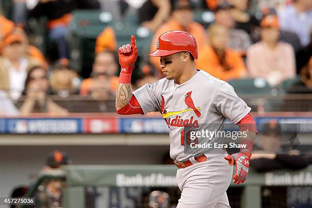 Kolten Wong of the St. Louis Cardinals rounds the bases after hitting a solo home run in the third inning against the San Francisco Giants during...