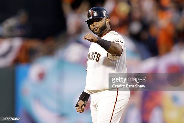 Pablo Sandoval of the San Francisco Giants reacts while on second base in the third inning against the St. Louis Cardinals during Game Four of the...