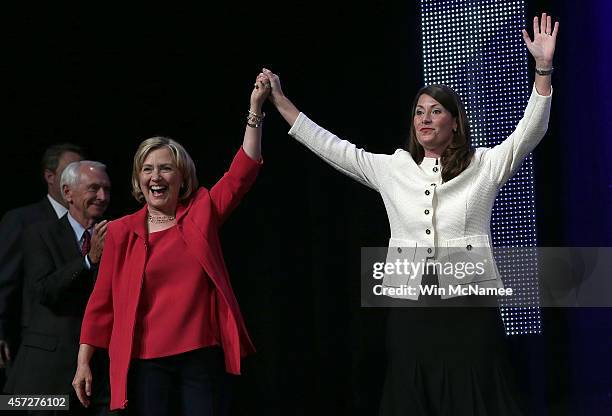 Former U.S. Secretary of State Hillary Clinton campaigns with U.S. Senate Democratic candidate and Kentucky Secretary of State Alison Lundergan...