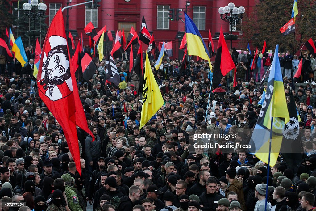 Supporters of Ukrainian Nationalist Party hold  torches and...