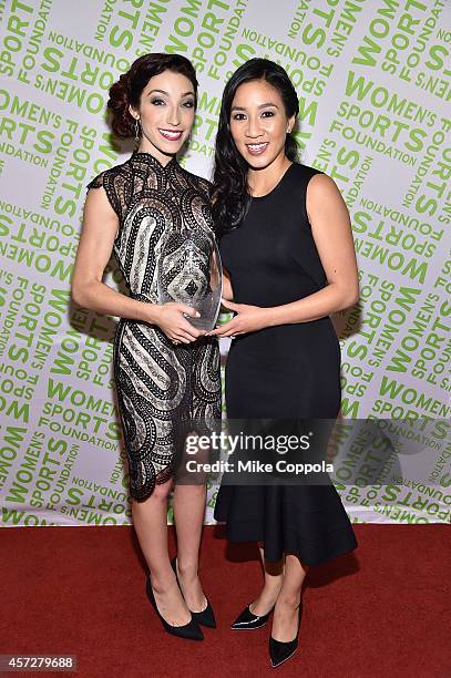 Olympic gold medal winning ice dancer Meryl Davis with the Sportswoman of the Year Award poses with Michelle Kwan during the Womens Sports...