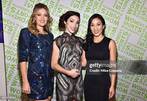 Snowboarder Amy Purdy, Olympic gold medal winning ice dancer Meryl Davis with the Sportswoman of the Year Award pose with Michelle Kwan during the...