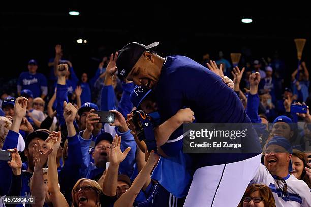 Salvador Perez of the Kansas City Royals celebrates with fans after their 2 to 1 win over the Baltimore Orioles to sweep the series in Game Four of...