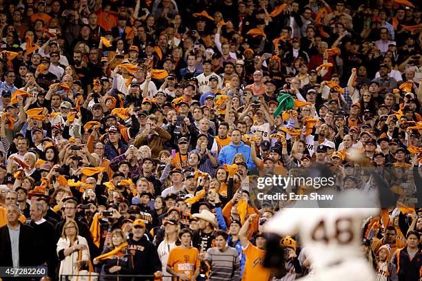 Santiago Casilla of the San Francisco Giants pitches in the ninth inning against the St. Louis Cardinals during Game Four of the National League...