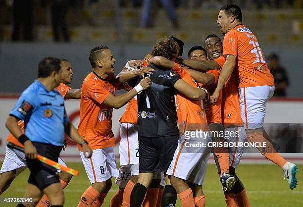 Perus Cesar Vallejo players celebrate the goal by goalkeeper Salomon Lipman which allows them to pass to quarter finals closing a set of kick shots...