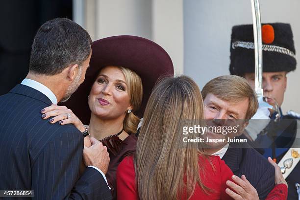 King Willem-Alexander of the Netherlands and Queen Maxima of the Netherlands kiss King Felipe VI of Spain and Queen Letizia of Spain goodbye after a...