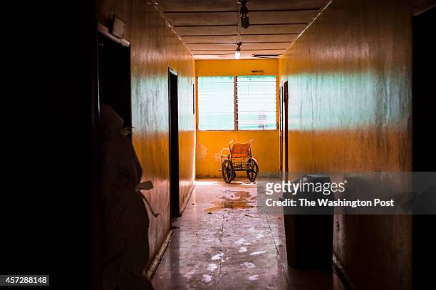 Empty wheelchair marks the scene inside a hallway near Ebola patients at the Redemption Hospital which has become a transfer and holding center to...