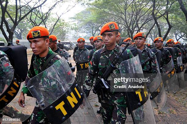 Indonesian soldiers take part in security preparations for the inauguration ceremony of President-elect Joko Widodo and vice president elect Jusuf...