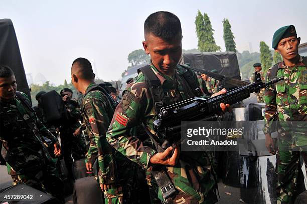 Indonesian soldiers take part in security preparations for the inauguration ceremony of President-elect Joko Widodo and vice president elect Jusuf...