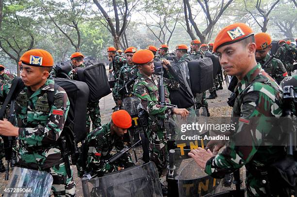 Indonesian soldiers take part in security preparations for the inauguration ceremony of President-elect Joko Widodo and vice president elect Jusuf...