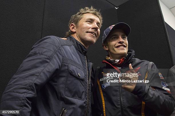 Marc Marquez of Spain and Repsol Honda Team poses with Troy Bayliss of Australia during the press conference ahead of the 2014 MotoGP of Australia on...