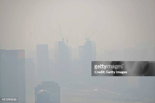 General view of buildings in heavy smog is seen at The Bund on October 16, 2014 in Shanghai, China. A report from Shanghai Environmental Monitoring...