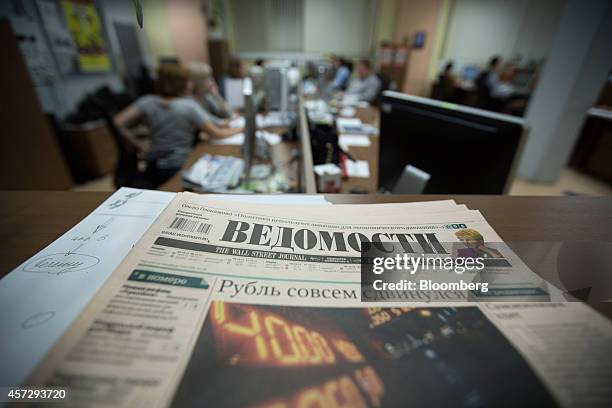 Copy of Vedomosti, a daily business newspaper owned by the Financial Times, the Wall Street Journal and Sanoma Oyj media group, sits on a desk in the...