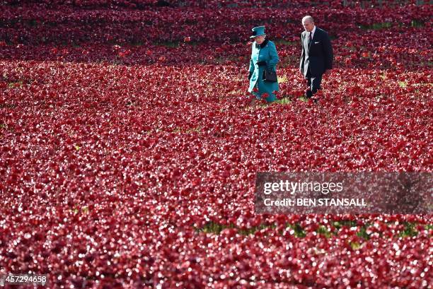 Britain's Queen Elizabeth II and husband Prince Philip, Duke of Edinburgh, visit the Tower of London's 'Blood Swept Lands and Seas of Red' poppy...