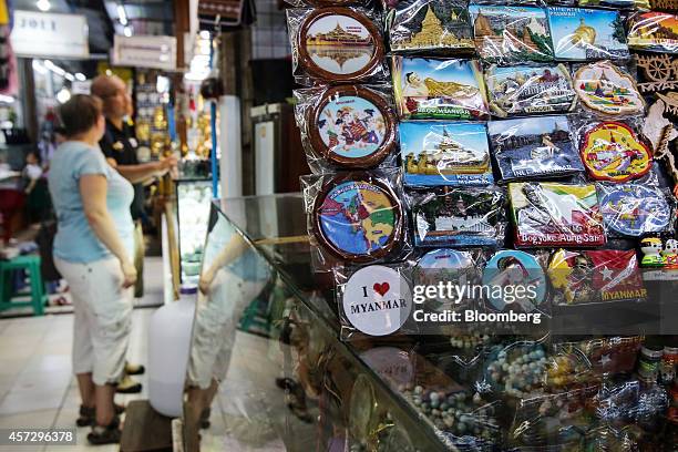 Souvenirs are displayed for sale at a store in the Bogyoke Aung San Market in Yangon, Myanmar, on Tuesday, Oct. 14, 2014. Myanmars economy is set to...