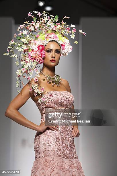 Model Katie Cleary on runway wearing SUE WONG at SUE WONG Spring 2015 "Fairies & Sirens" Fashion Show on October 15, 2014 in Los Angeles, California.