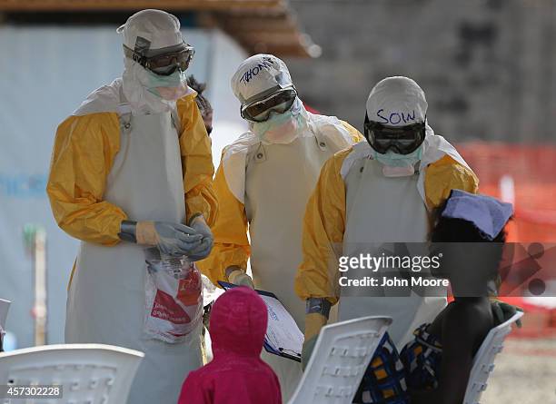 Health workers at Doctors Without Borders , talk with Ebola patients in the high-risk area of the ELWA 3 Ebola treatment center on October 16, 2014...