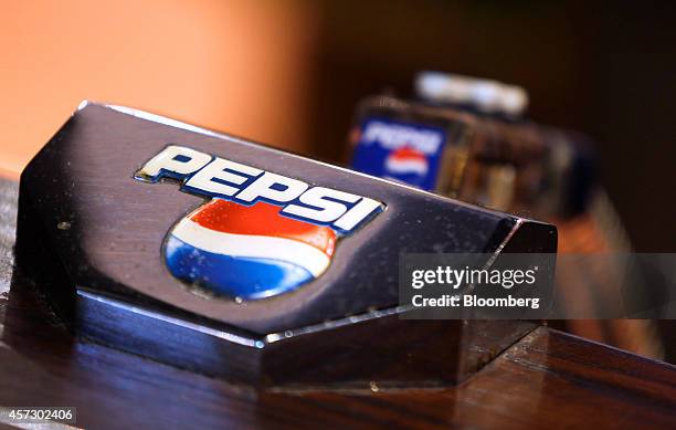 Pepsi logo sits on a PepsiCo Inc. Soft drinks pump on the bar inside The Yew Tree pub, operated by Chef and Brewer, a unit of Spirit Pub Co., in...