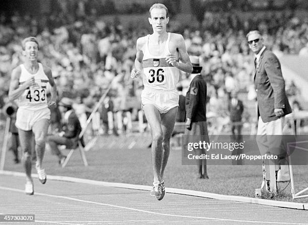 Harald Norpoth of West Germany crosses the finish line in 4th place, ahead of John Whetton of Great Britain in 5th place, in the final of the Men's...