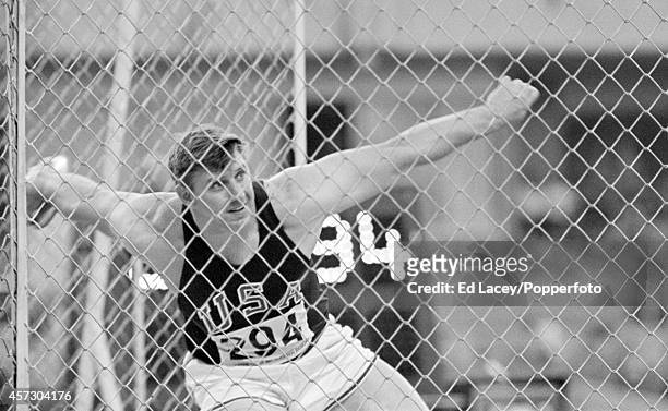 American athlete Al Oerter of the United States competing to finish in first place gold medal position in the Men's discus throw event at the 1968...