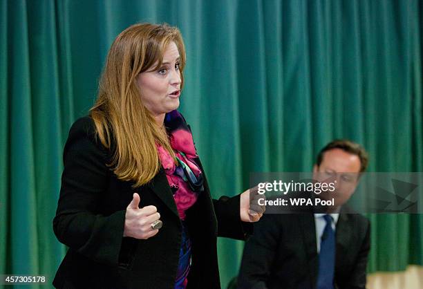 Prime Minister David Cameron listens to one of the Conservative Party's two applicants councillor Kelly Tolhurst as she speaks ahead of her...