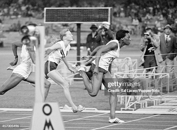 Wyomia Tyus of the United States crosses the finish line in first place to win the gold medal, ahead of 2nd placed Barbara Ferrell of the United...