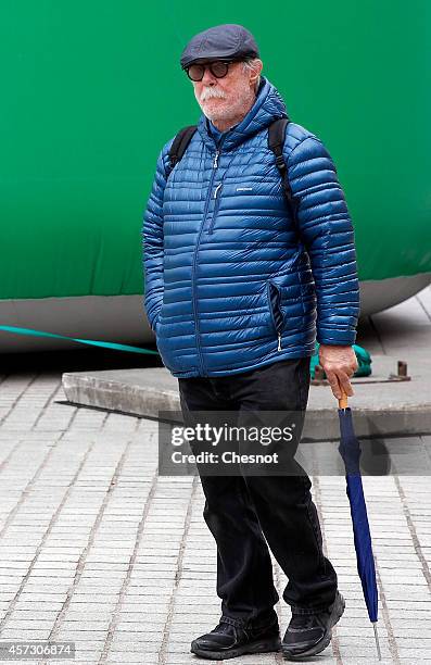 Artist Paul McCarthy walks in front of 'Tree', his monumental artwork at Place Vendome on October 16 in Paris, France. This installation is part of...