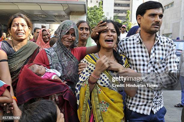 Mother of the deceased Sanjay Kumar grieving at district hospital after a wall collapsed, at Barola village, on October 16, 2014 in Noida, India. At...