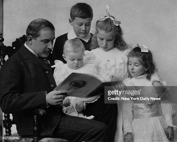 Rare and early foto of J. P. Morgan, showing the financier with his children. In his arms is Henry Sturges Morgan, now a lieutenant commander in the...