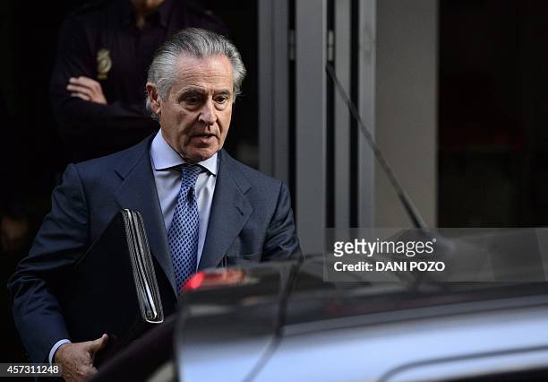 Caja Madrid's former head Miguel Blesa leaves a hearing in Madrid on October 16, 2014 accused of spending sprees with a company credit card while he...