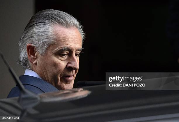 Caja Madrid's former head Miguel Blesa leaves a hearing in Madrid on October 16, 2014 accused of spending sprees with a company credit card while he...