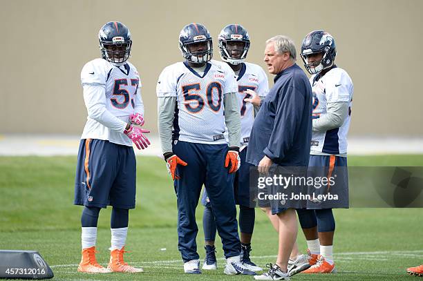 Denver Broncos linebackers coach talks with Denver Broncos linebacker Steven Johnson Denver Broncos linebacker Lamin Barrow and Shaquil Barrett and...