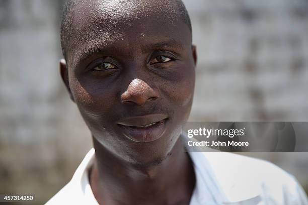 Ebola survivor John Massani stands in the low-risk section of the Doctors Without Borders , Ebola treatment center on October 16, 2014 in...