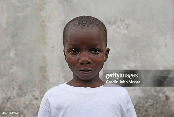 Ebola survivor Abrahim Quota stands outside the JFK Ebola treatment center after recovering from the disease on October 13, 2014 in Monrovia,...