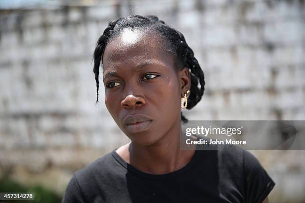 Ebola survivor Benetha Coleman stands in the low-risk section of the Doctors Without Borders , Ebola treatment center after attending a survivors'...