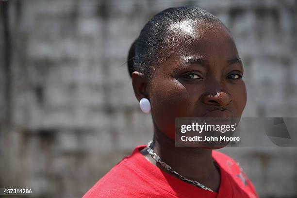 Ebola survivor Victoria Masah stands in the low-risk section of the Doctors Without Borders , Ebola treatment center on October 16, 2014 in...