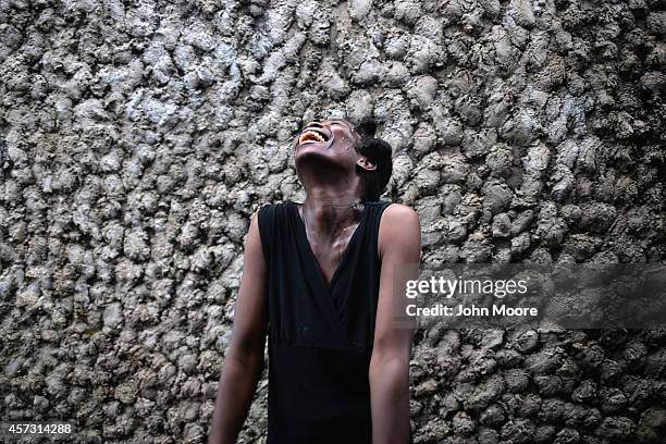 Ebola survivor Sontay Massaley smiles upon her release from the Doctors Without Borders , Ebola treatment center on October 12, 2014 in Paynesville,...