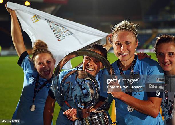Manchester City Women's Captain Steph Houghton poses with the trophy after winning the FA WSL Continental Cup Final between Arsenal Ladies and...