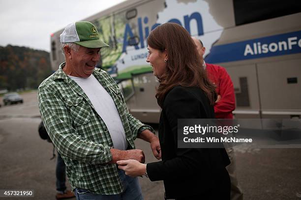 Senate Democratic candidate and Kentucky Secretary of State Alison Lundergan Grimes greets voters before speaking at a rally at the Central Kentucky...