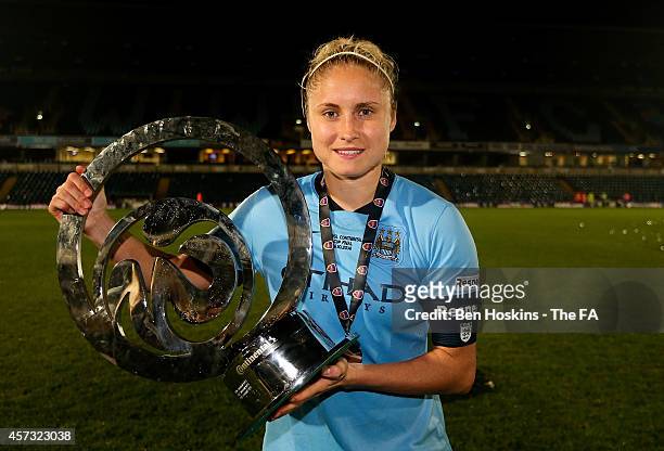 Manchester City Captain Steph Houghton poses with the trophy following the Continental Cup Final between Arsenal Ladies and Manchester City Ladies at...
