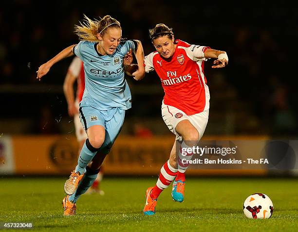 Kelly Smith of Arsenal holds off pressure from Keira Walsh of Manchester City during the Continental Cup Final between Arsenal Ladies and Manchester...