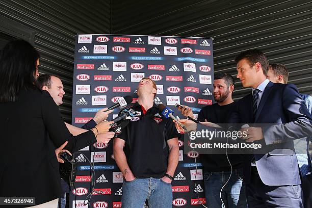 New recruit Adam Cooney is distracted by a Bee during an Essendon Bombers AFL media session at True Value Solar Centre on October 17, 2014 in...