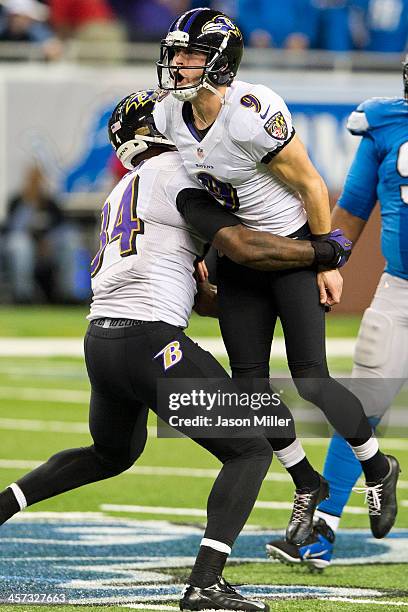 Tight end Ed Dickson of the Baltimore Ravens celebrates with kicker Justin Tucker of the Baltimore Ravens after Tucker hit a 61-yard field goal with...