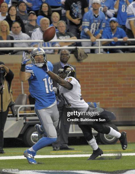 Baltimore Ravens' Lardarius Webb, right, breaks up a pass in the end zone intended for Detroit Lions' Kris Durham during the third quarter at Ford...