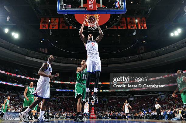 Arnett Moultrie of the Philadelphia 76ers dunks against the Boston Celtics on October 16, 2014 at Wells Fargo Center in Philadelphia, Pennsylvania....